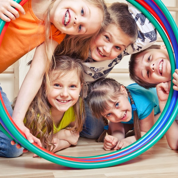 A group photo of kinds on play room