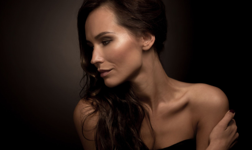 A portrait photo of woman with dark hair