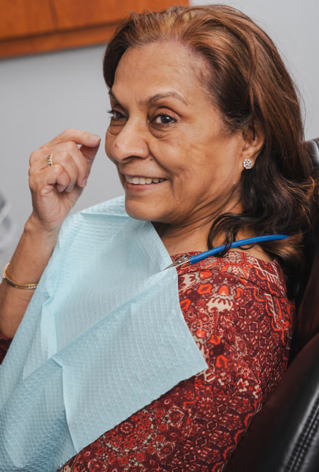 A woman sitting in the dental chair