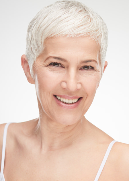 Adult woman with light hair is smiling