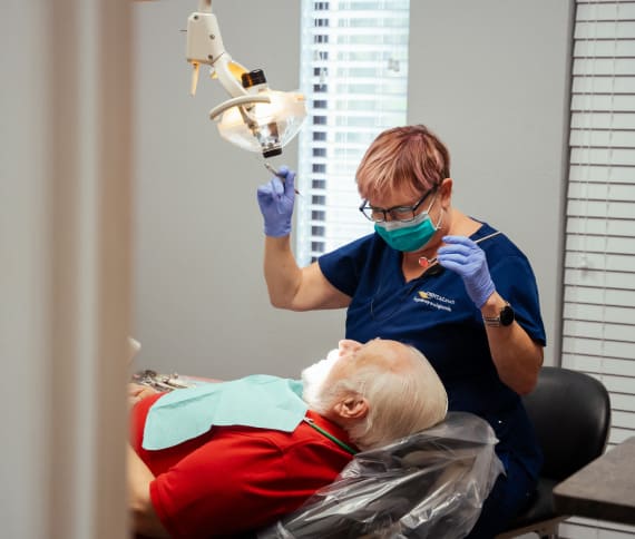 Photo of a doctor and patient in dental chair