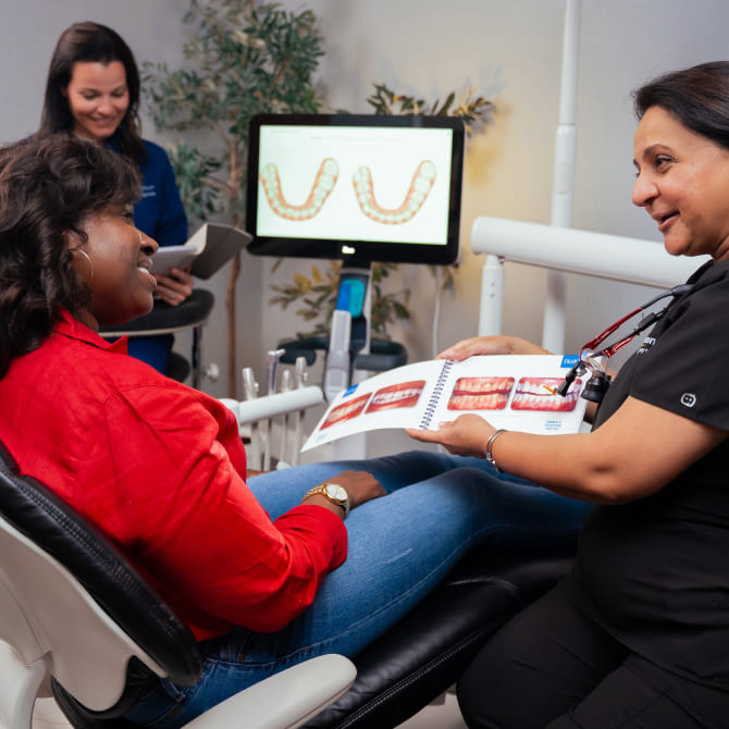 Photo of a doctor and patient in dental chair