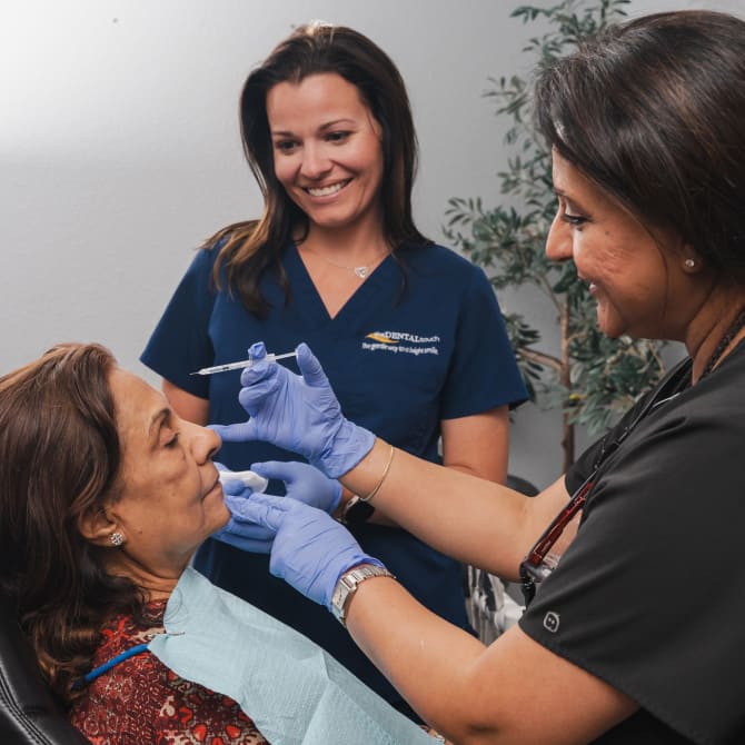 Doctor making a Botox injection to the patient
