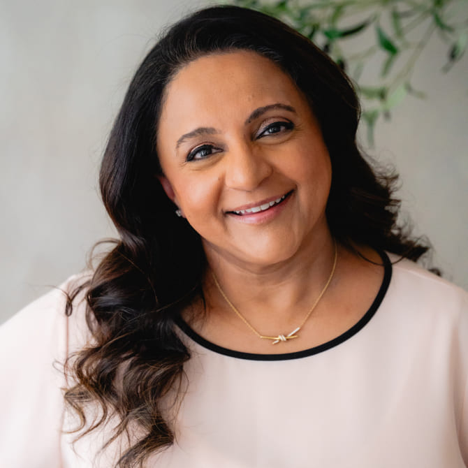 Doctor smiling while wearing white top