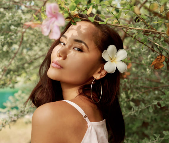 Girl with flowers on her head smiling