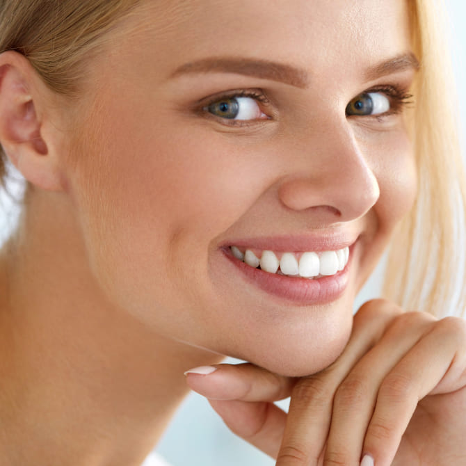 Revitalize Your Face: Contouring for a Younger You Girl with light hair is smiling