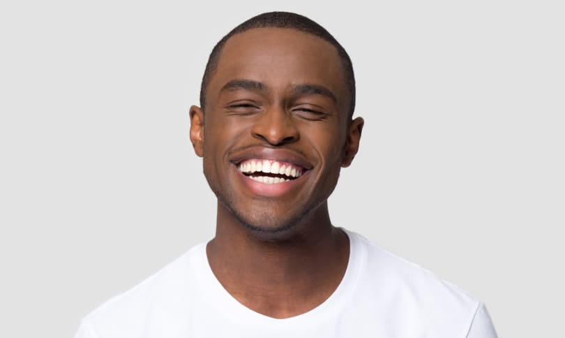 Happy smiling patient with shining white smile