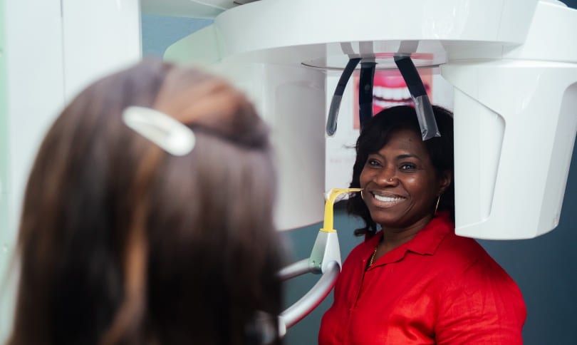 Patient standing inside in the x-ray machine