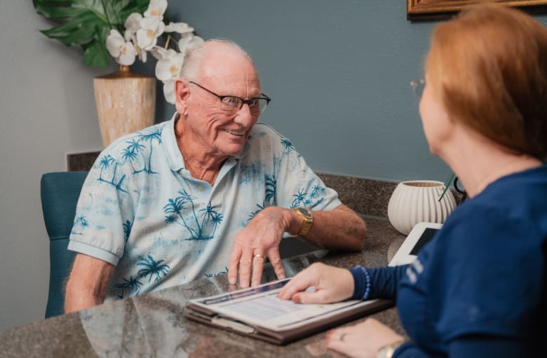Smiling patient and team member are smiling