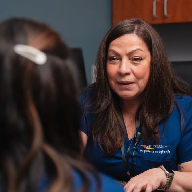 Team member talking with a patient