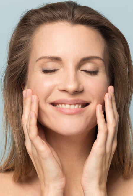 Woman smiling with close eyes