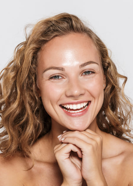 Woman smiling with curly hair