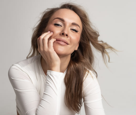 Woman with brown hair smiling