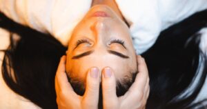 A patient relaxes as she receives a facial massage before treatment at The Dental Touch in Leesburg, Fl.