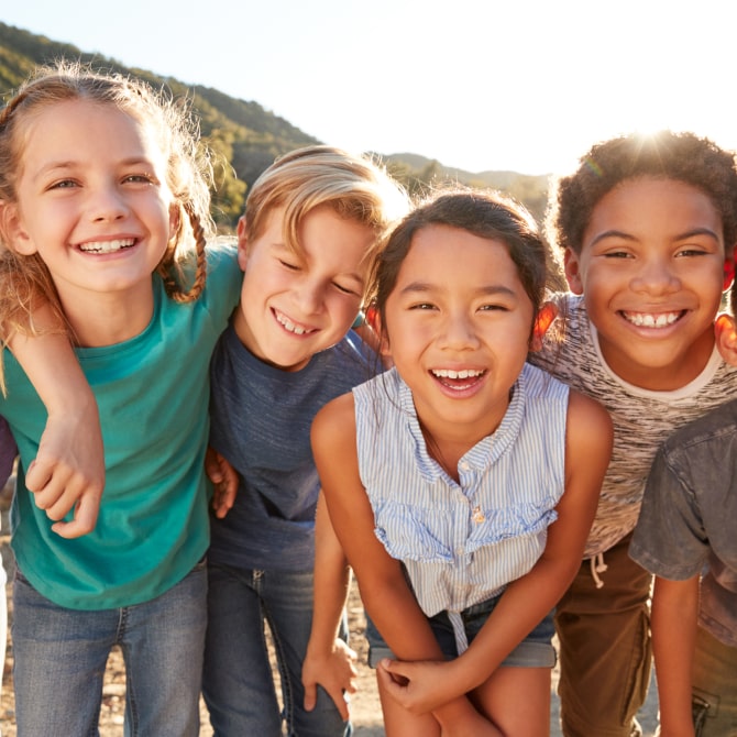 A photo of group smiling kids